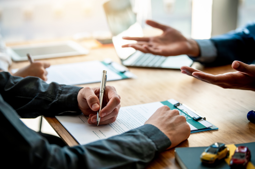 A lawyer explaining terms to a client, discussing legal matters related to a business partner, such as contractual disputes or partnership dissolution.