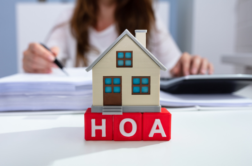 A model house and the acronym HOA represent a discussion about unenforceable HOA rules in Texas. This may refer to situations where HOA regulations conflict with state statutes, making them unenforceable in court.